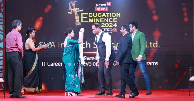 On stage at the News18 Bangla Education Eminence 2024 awards